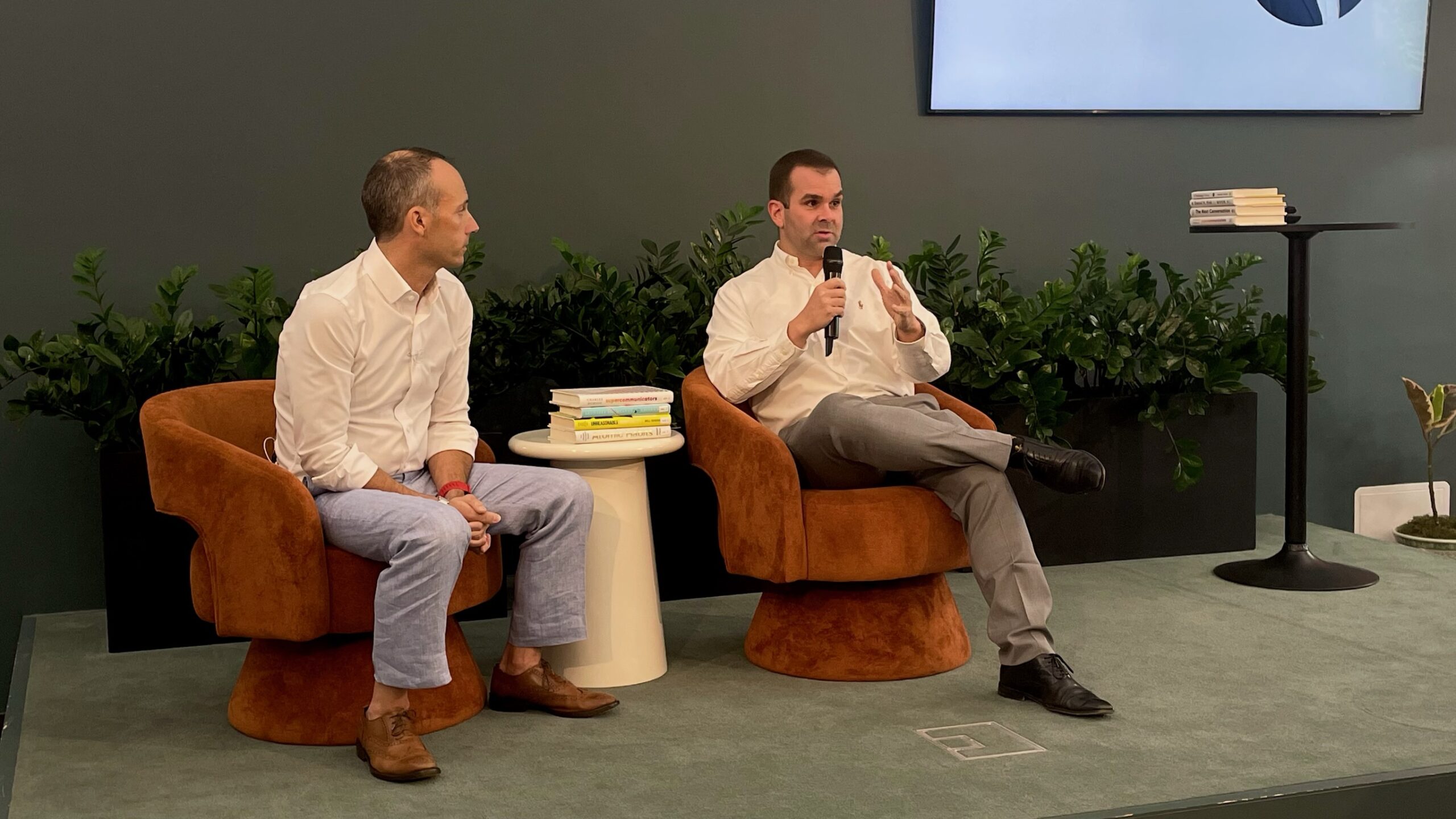 Clayton Fields and Jeffrey Doussan onstage at KW New Orleans discussing agent lawsuits and agency disclosure